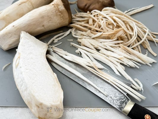 shredded king oyster mushrooms into noodles 