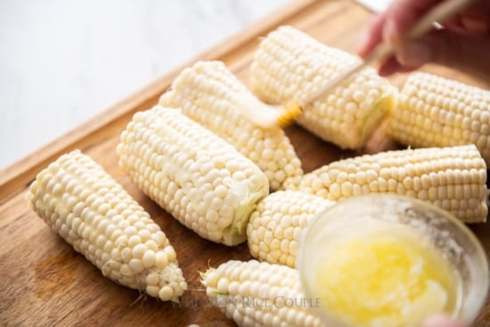 Melted butter brushed on corn 