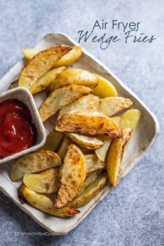 Plate of air fried French fries with side ketchup for dipping