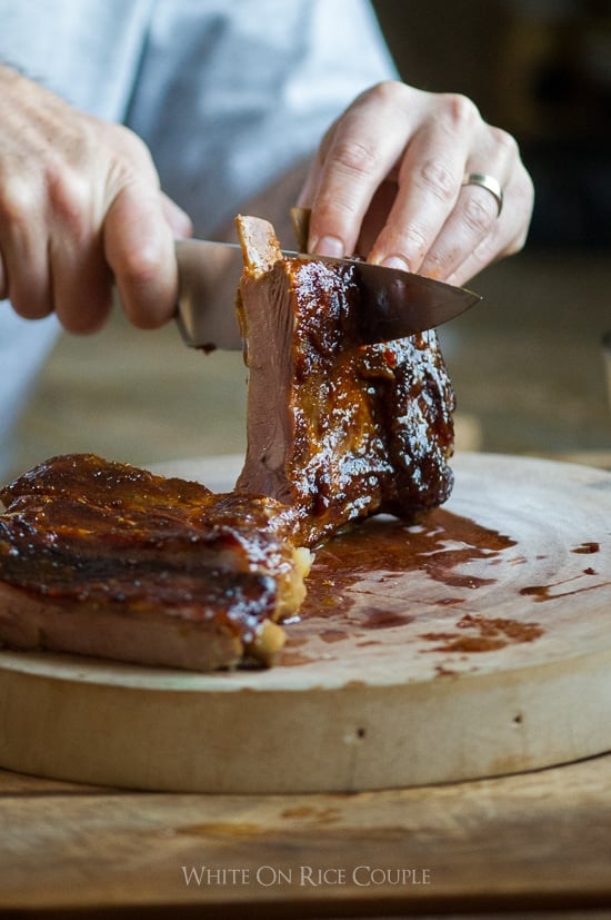 Asian Baked Pork Ribs getting cut