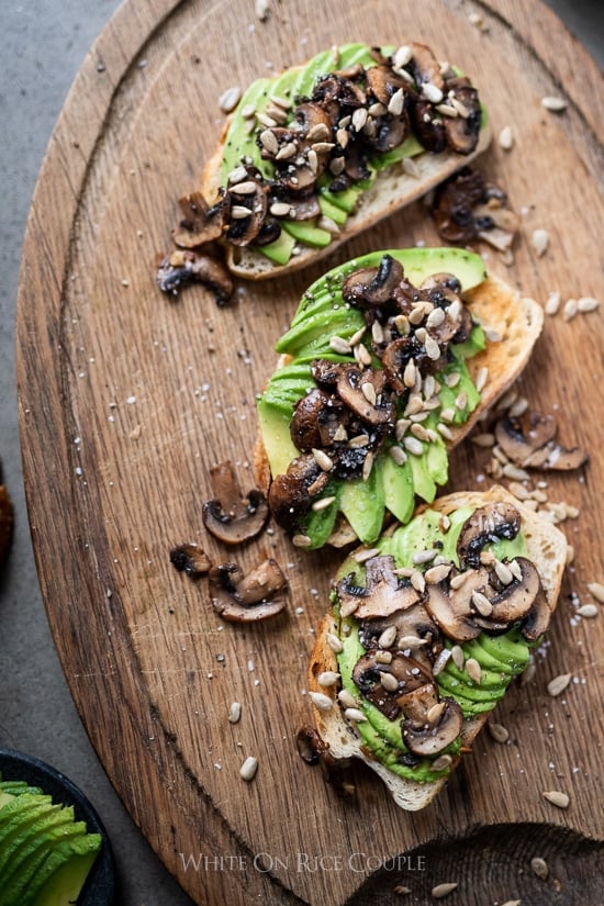 Garlic Mushroom Avocado Toast on a cutting board