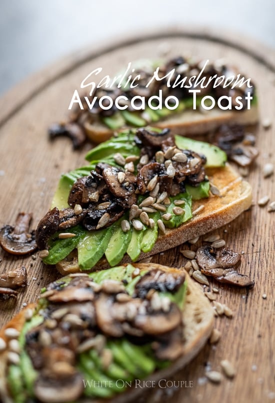 Garlic Mushroom Avocado Toast on a cutting board up close