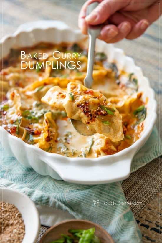 holding spoon of baked curry dumpling