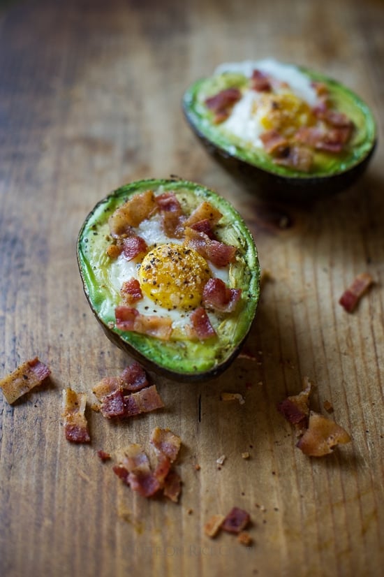 Baked Eggs in Avocado on a board