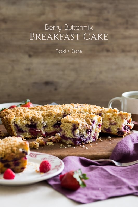 Blueberry Buttermilk Breakfast Cake with Berries on a cutting board