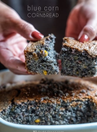 holding piece of blue corn cornbread