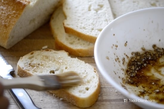 Brushing marinade on bread slice