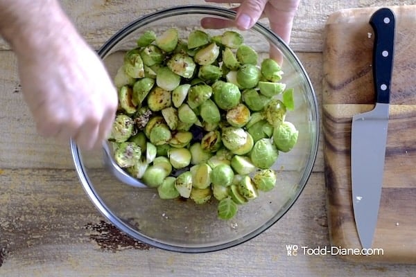 Tossing brussels sprouts with marinade