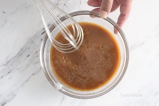 Whisking sauce together
