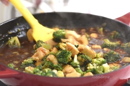 Scooping the chicken and broccoli