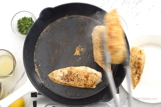 Removing seared chicken from skillet