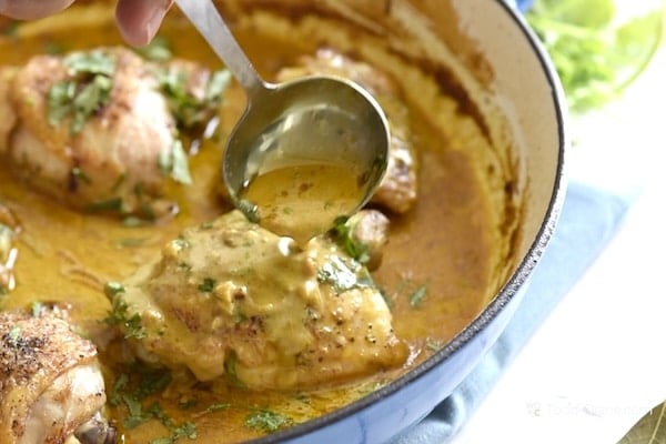 Spooning sauce over chicken