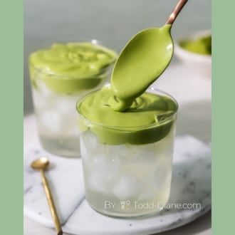 matcha cloud over glass of coconut water