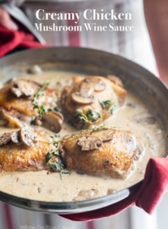Skillet chicken recipe in creamy garlic mushroom wine sauce | WhiteOnRiceCouple.com
