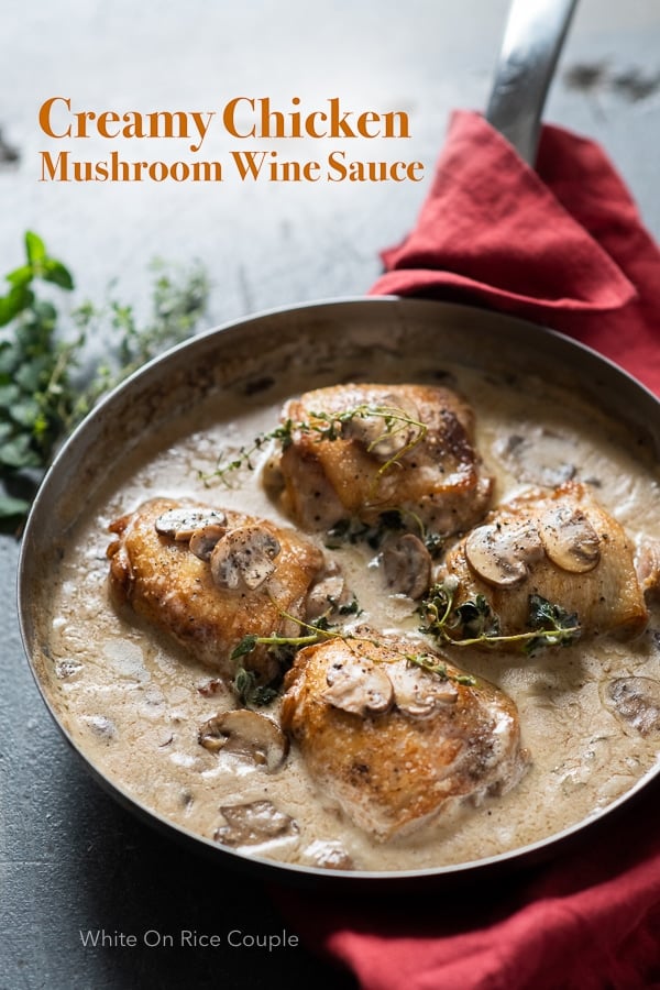 Skillet chicken recipe in creamy garlic mushroom wine sauce in a skillet