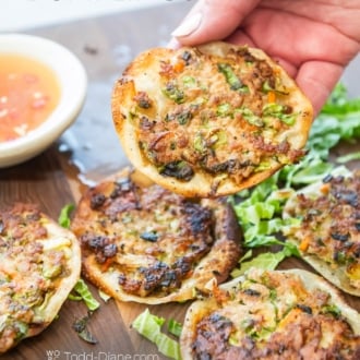 holding a crispy smash egg roll dumpling
