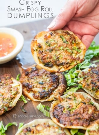 holding a crispy smash egg roll dumpling