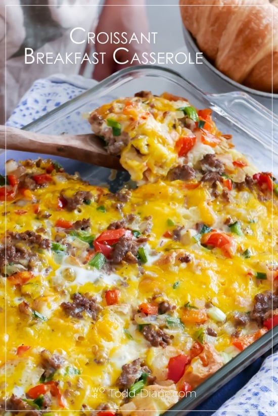 spoon with serving of croissant breakfast casserole bake