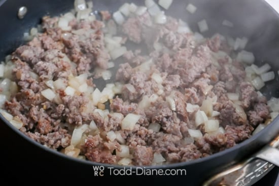 cooking onions and sausage