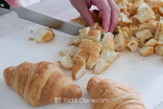 cutting croissant into bite sized pieces