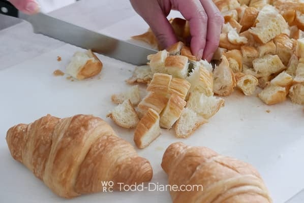 cutting croissant into bite sized pieces