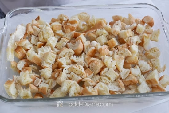 layering cut croissant pieces in baking dish