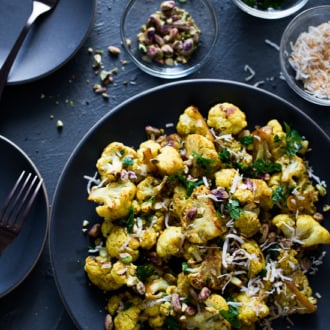Roasted Curry Cauliflower with Turmeric, Pistachios, Coconut Flakes | @whiteonrice