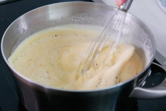 Stirring cheese sauce
