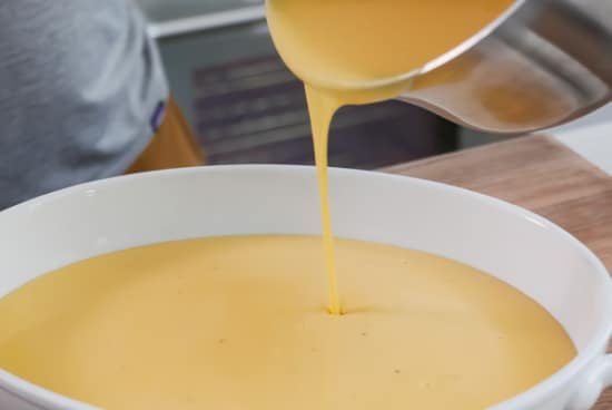 Pouring sauce into baking dish