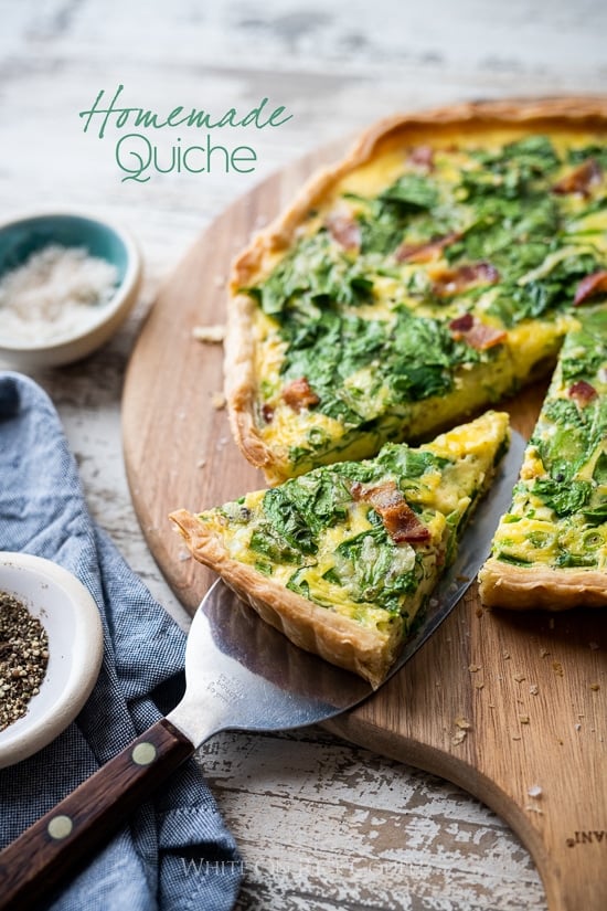 Easy Quiche Lorraine Recipe on a spatula on a cutting board