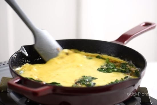Bringing in sides of egg in pan