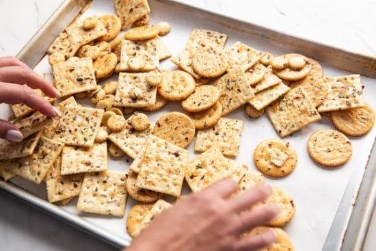 Spreading crackers on baking sheet pan