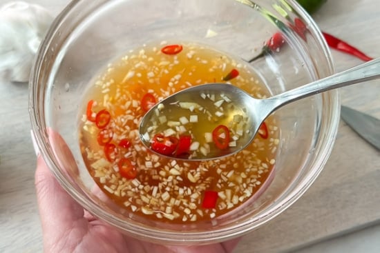 Spoonful of Vietnamese fish sauce dressing