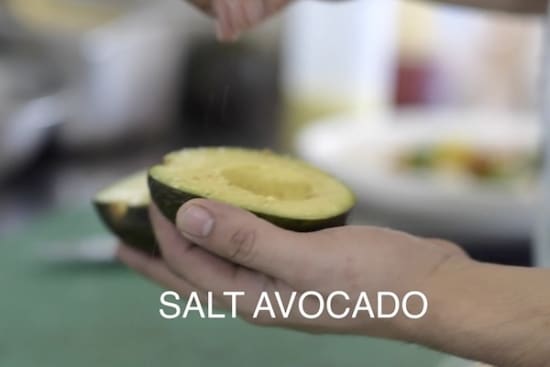 Salting an avocado half
