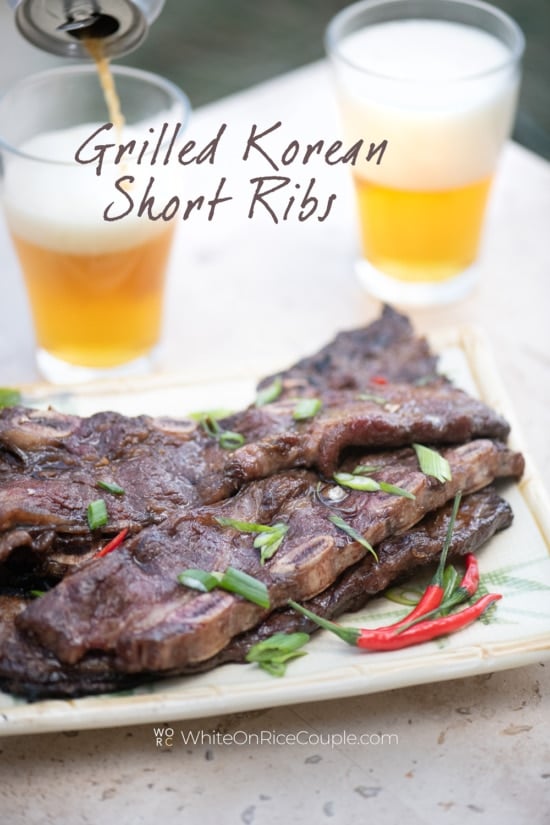 grilled Korean Kalbi short ribs served with beer by white on rice couple 