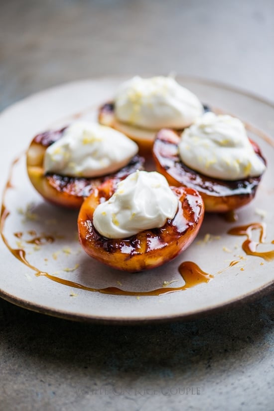 Grilled Peaches Recipe with Creme Fraiche or Whipped Cream on a plate