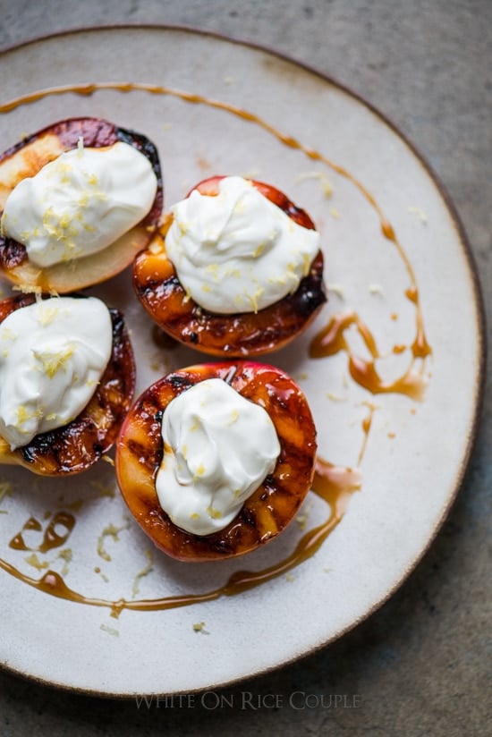 Grilled Peaches Recipe with Creme Fraiche or Whipped Cream on a plate