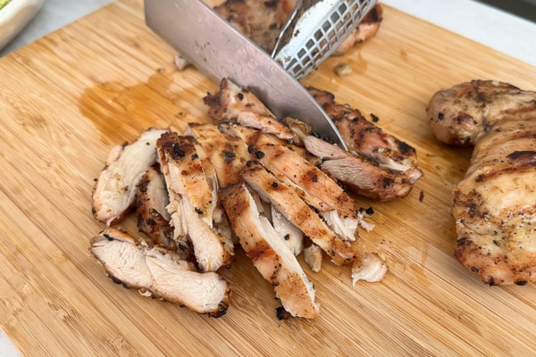 Cutting chicken into strips