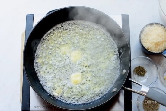 Butter and garlic cooking in a skillet
