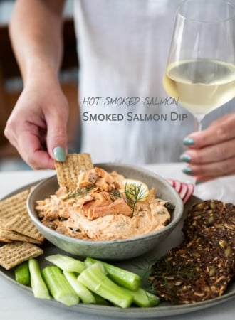 dipping into hot smoked salmon dip