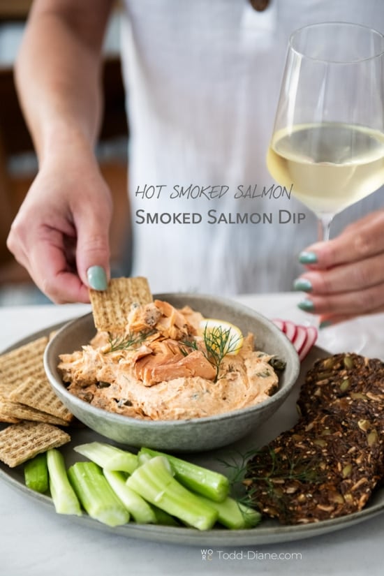 dipping into hot smoked salmon dip 