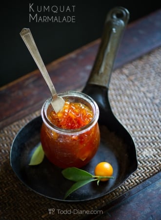 jar of kumquat marmalade on pan