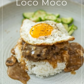 loco moco on plate with cucumber salad
