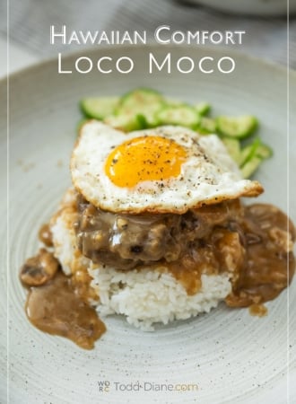 loco moco on plate with cucumber salad