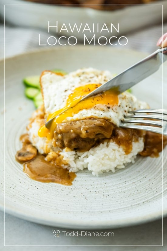 cutting into egg on loco moco