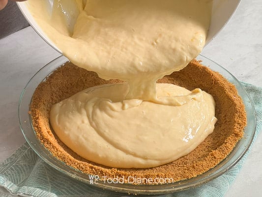 Pouring filling into baked crust