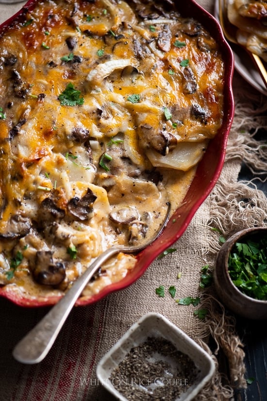 Mushroom Gravy Scalloped Potatoes in a ceramic dish close up