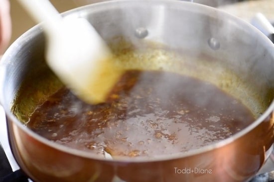 Simmering orange sauce
