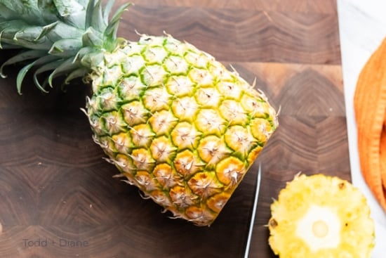 cutting base of pineapple