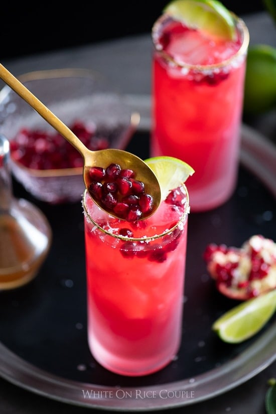 Pomegranate Margarita pouring pomegranate into glass